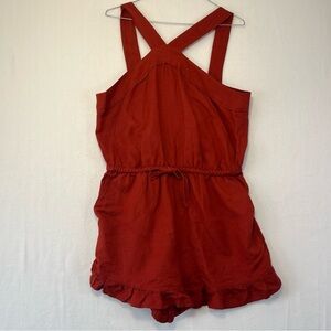 Burnt orange red LOFT romper with ruffle hem and halter style neck size s
